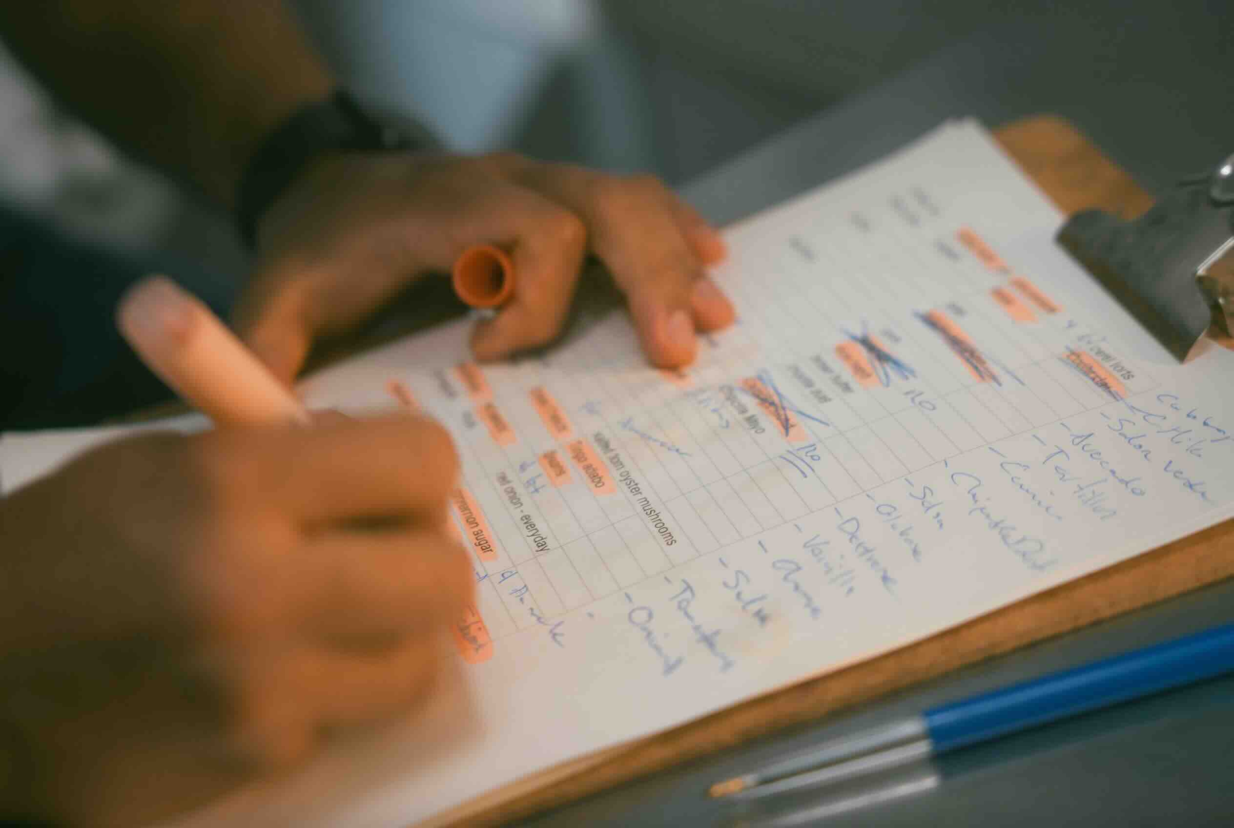 Chef writing food cost notes
